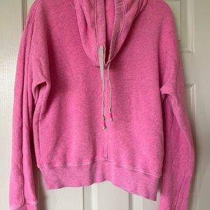 One light blue and one neon pink sweater